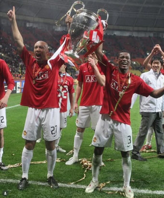 Mikaël Silvestre celebrating a trophy with Manchester United